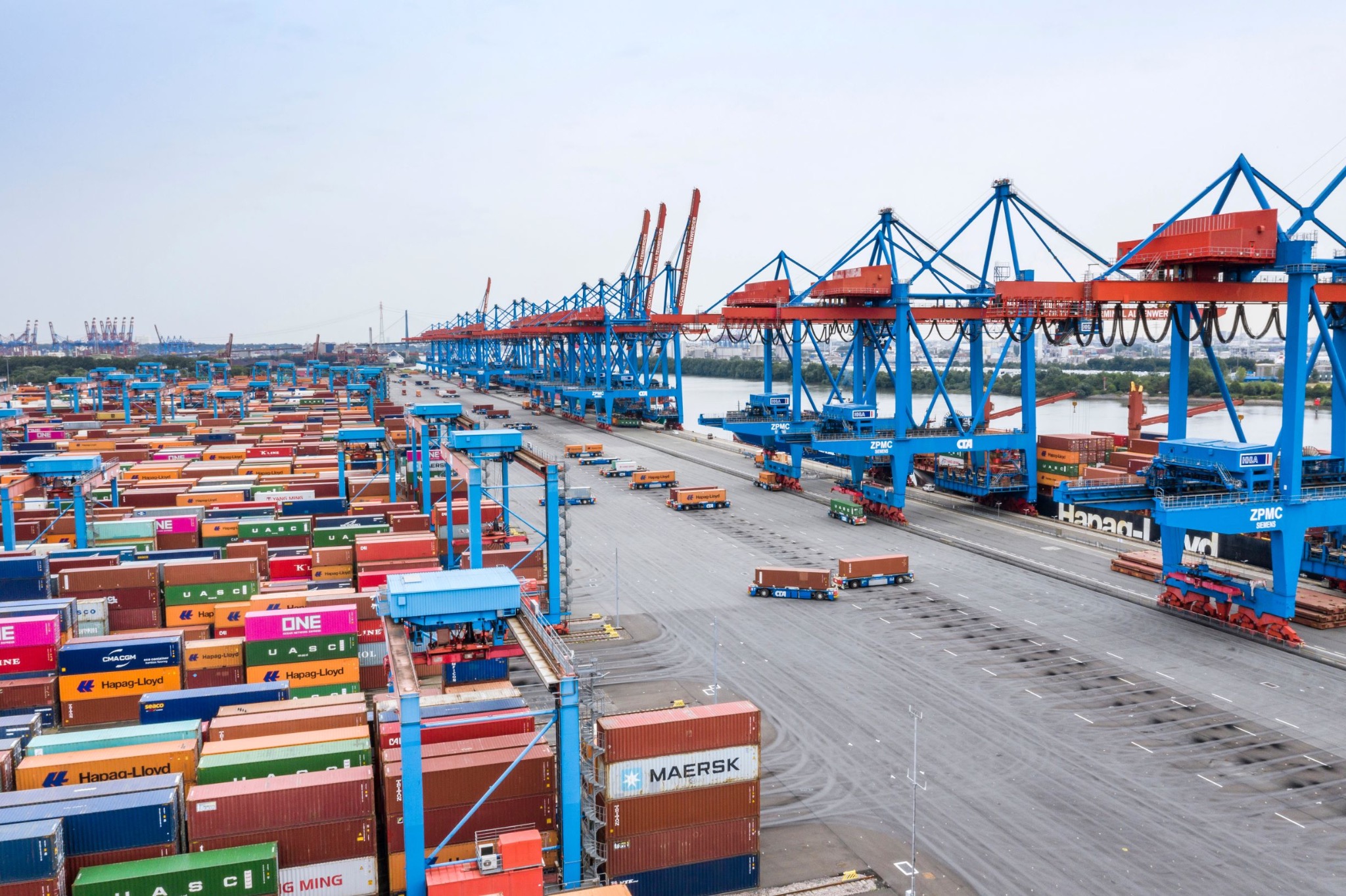 Container terminal with cranes and stacked freight containers